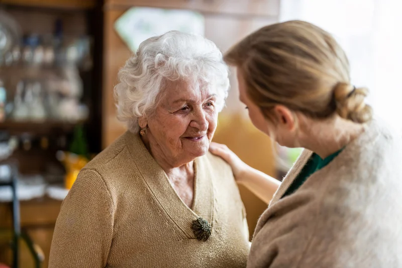 happydementiacareresidentinmemorycare Happy Dementia Care resident with care giver in Georgetown TX